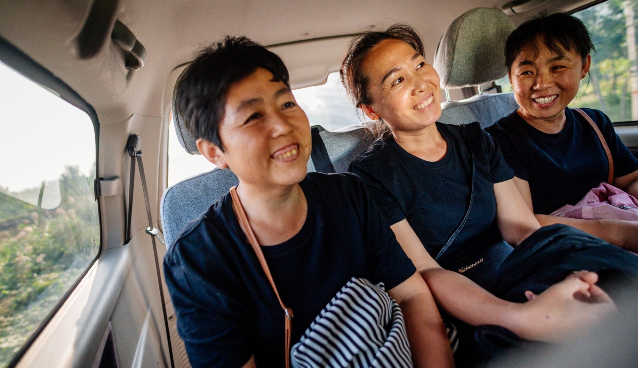 Employees get a ride home in a van as part of the ride share program